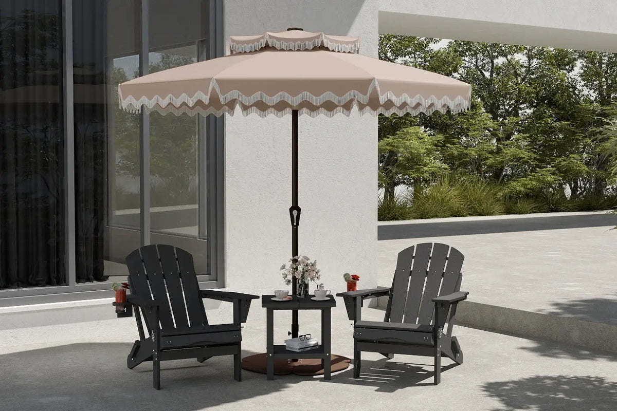 Outdoor patio set with two chairs and a table under a large umbrella on a patio.