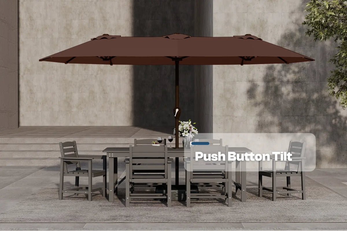 Outdoor dining set with a large brown umbrella on a stone patio.