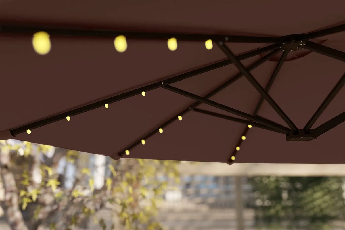 Brown patio umbrella with string lights against a blurred outdoor background