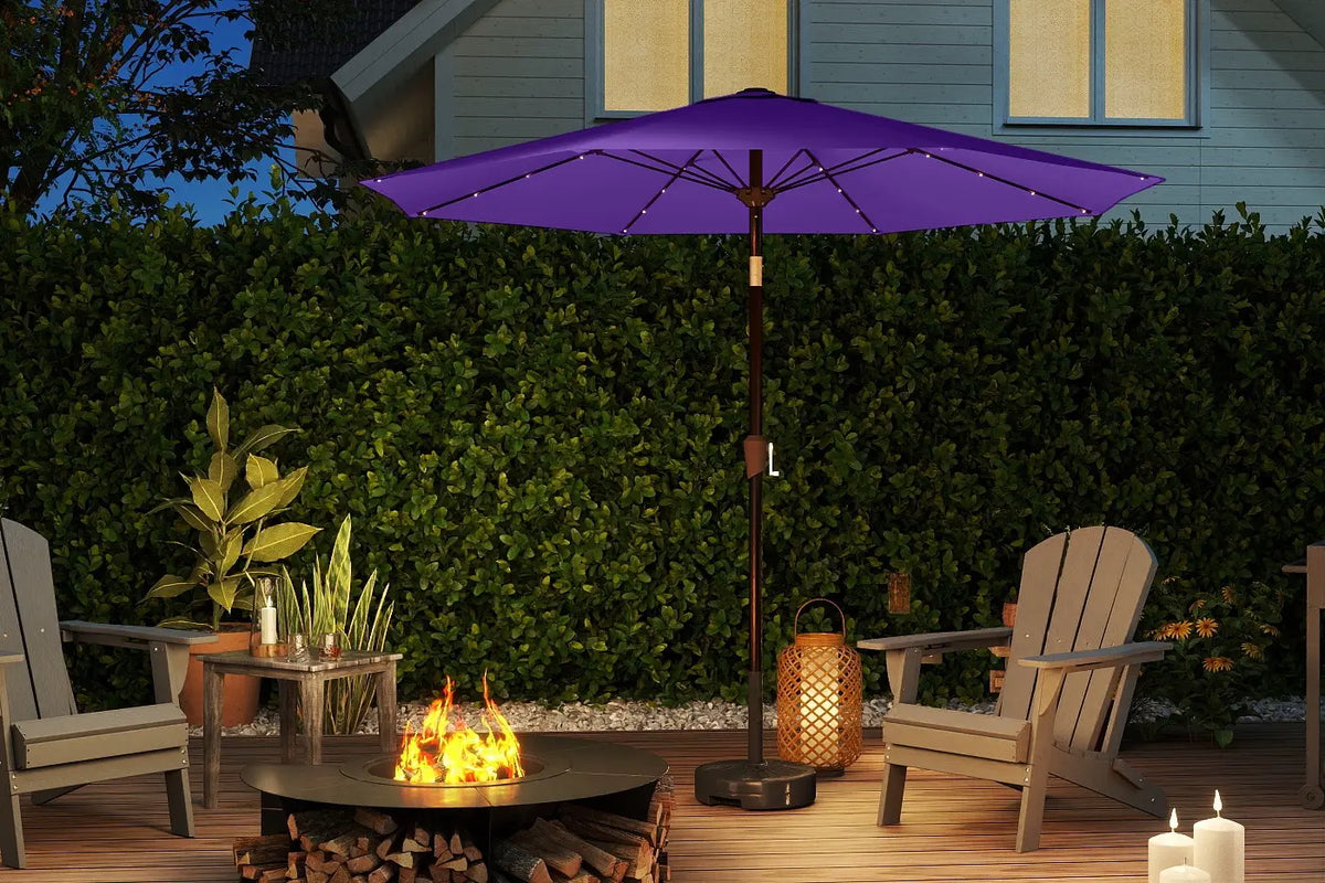 Outdoor patio scene with purple umbrella, fire pit, and Adirondack chairs.