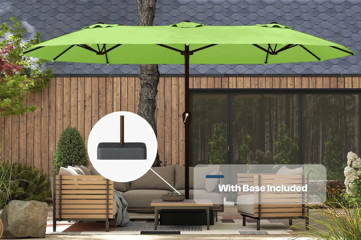 Green patio umbrella with base included in a garden setting