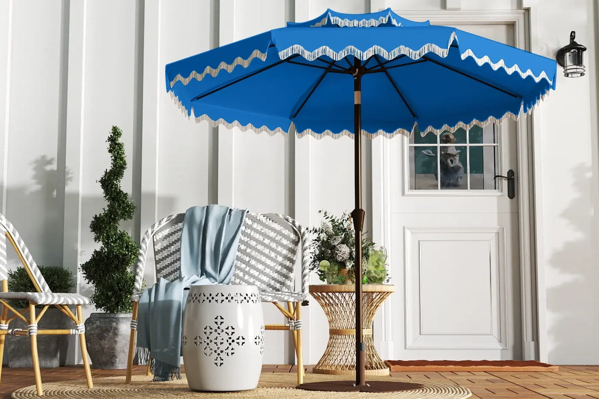 Blue patio umbrella with white trim on a wooden deck