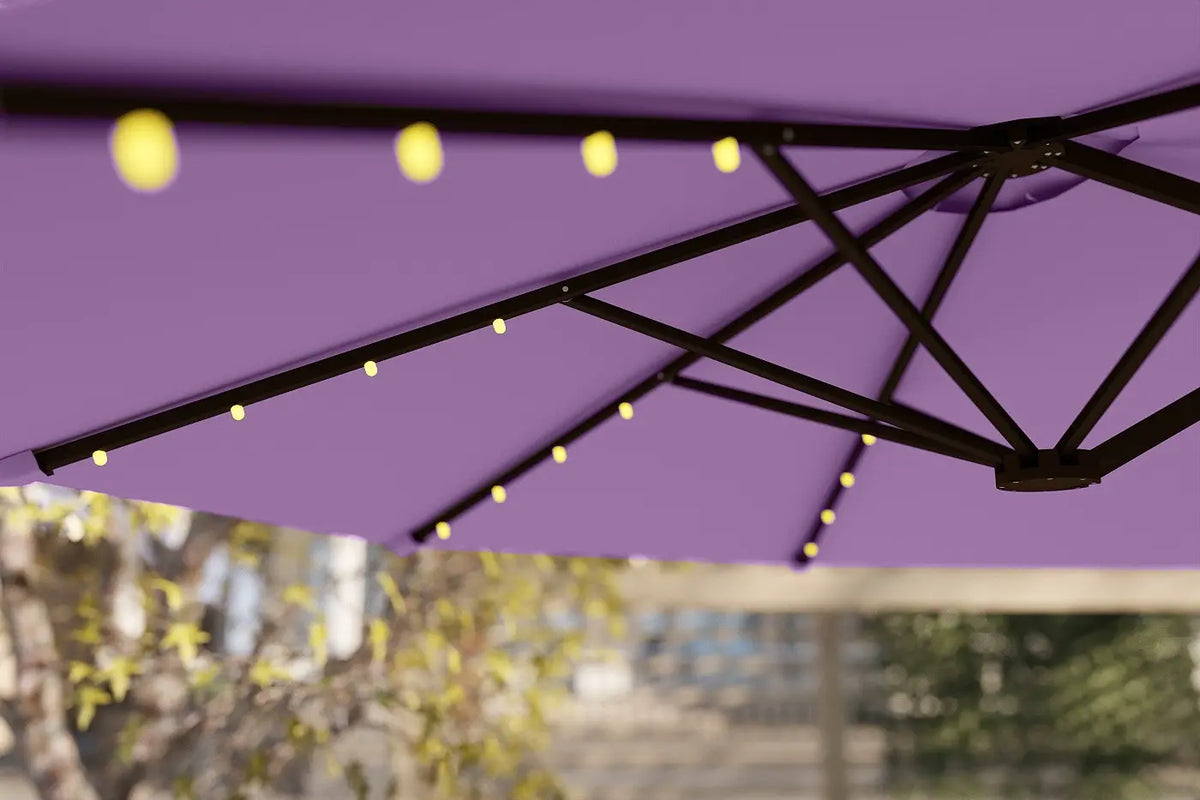 Purple patio umbrella with string lights against a blurred outdoor background