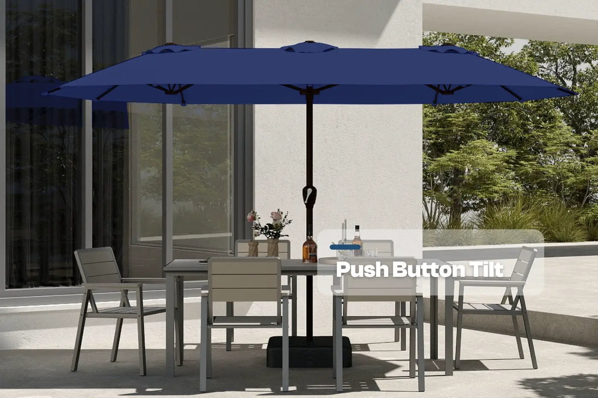 Outdoor patio set with a large blue umbrella on a sunny day.