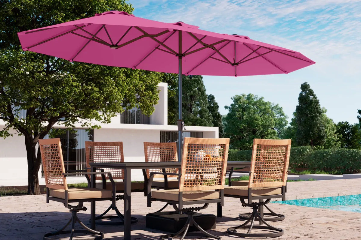 Outdoor dining set with pink umbrella by a poolside
