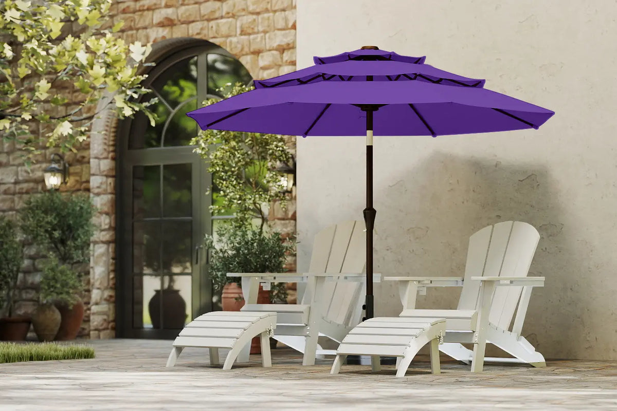 Purple patio umbrella over two white Adirondack chairs on a patio.