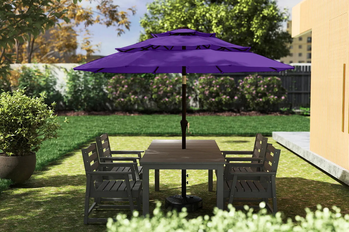 Outdoor patio set with a purple umbrella on a grassy area.