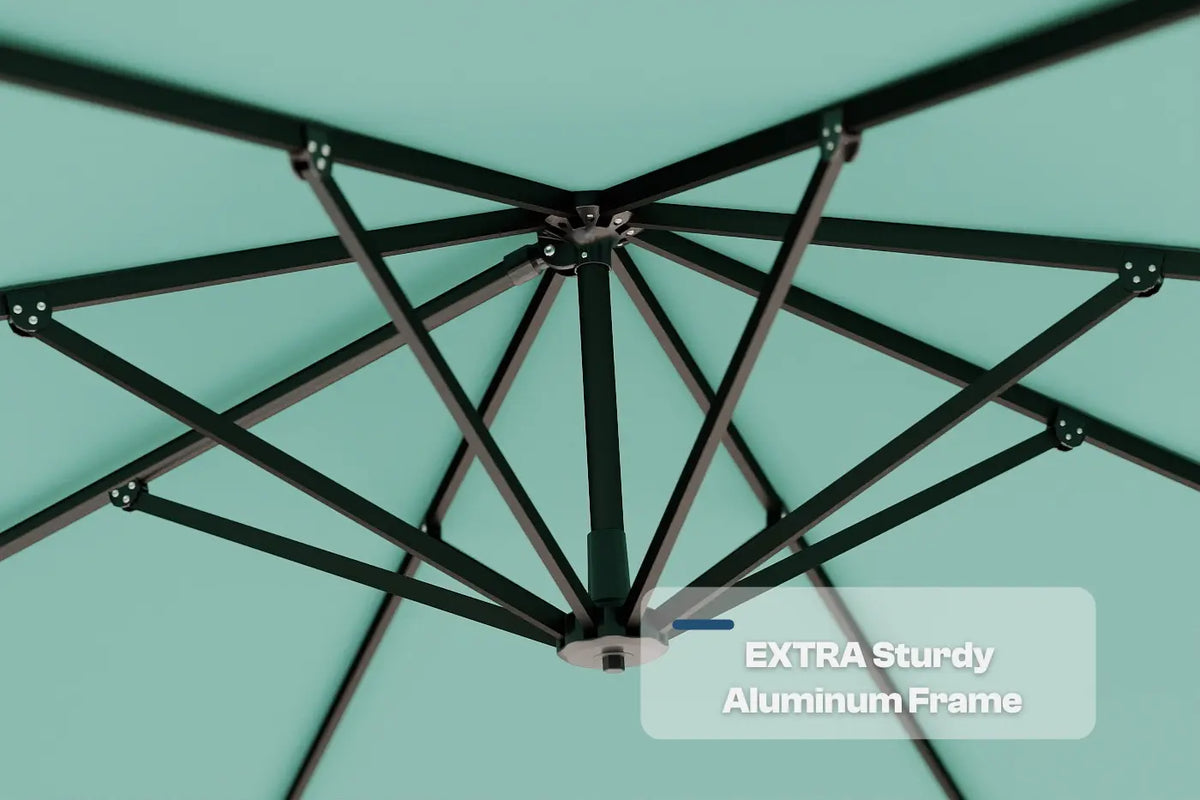 Close-up of an umbrella's black aluminum frame against a teal background with 'Extra Sturdy Aluminum Frame' text.