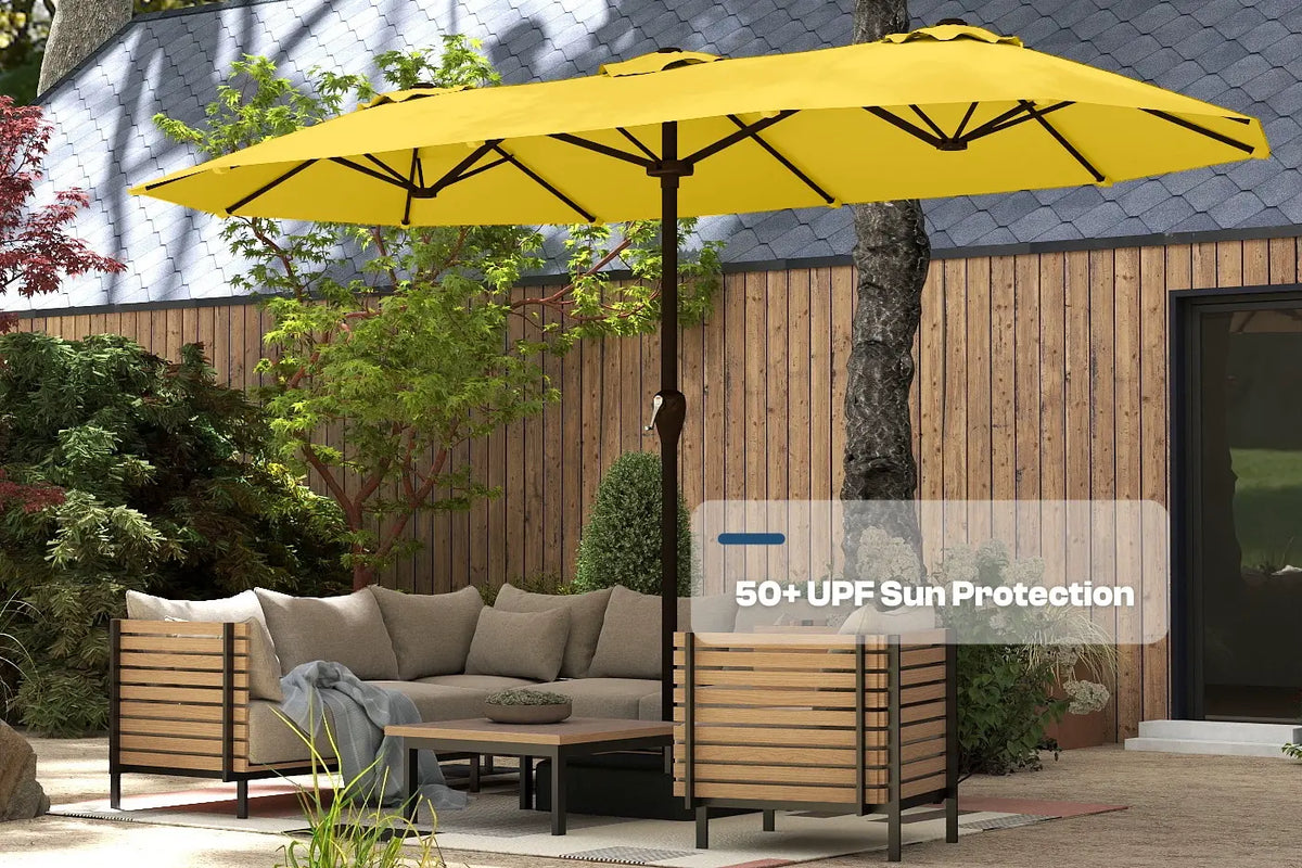Yellow patio umbrella providing 50+ UPF sun protection over outdoor furniture.