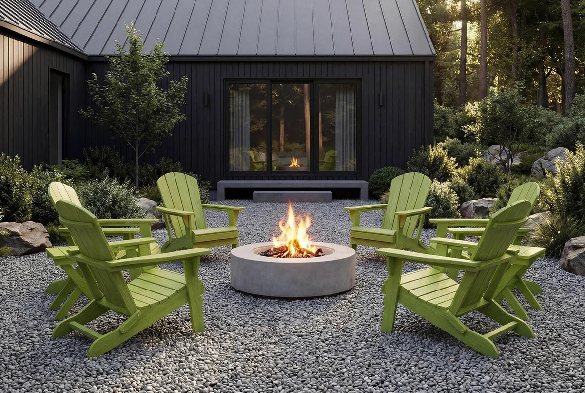 Green Adirondack chairs around a fire pit in front of a dark wooden cabin.