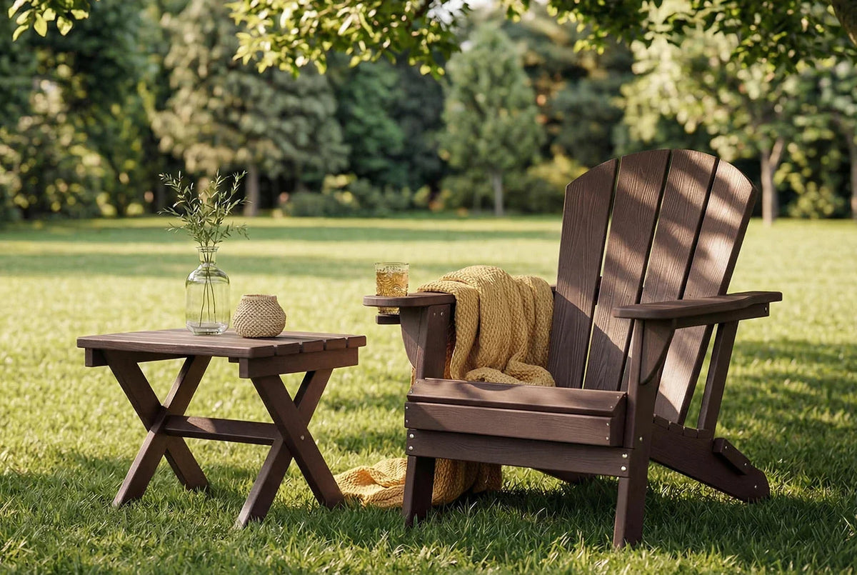 HDPE Adirondack chair with a small table on a grassy lawn with trees in the background