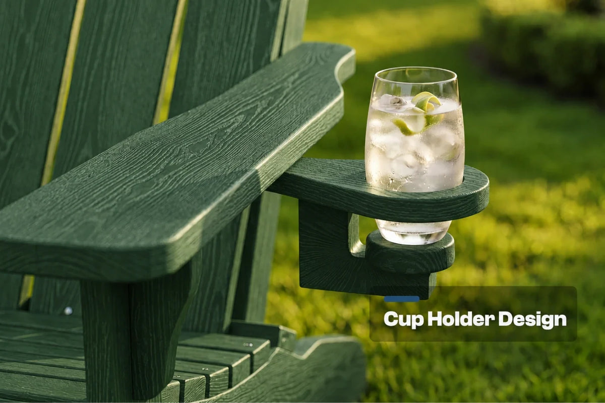 A dark green outdoor Adirondack-style chair with a built-in cup holder on the armrest, holding a clear glass of iced water. The background shows a blurred green lawn, and a text overlay reads 'Cup Holder Design'.