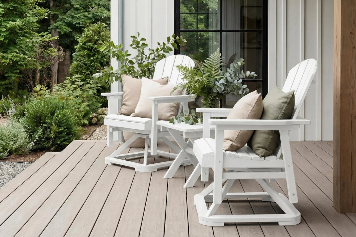 White outdoor chairs with cushions on a wooden deck