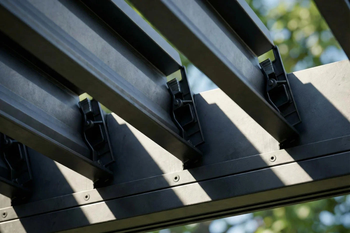 Close-up of a grill louvered pergola in the background