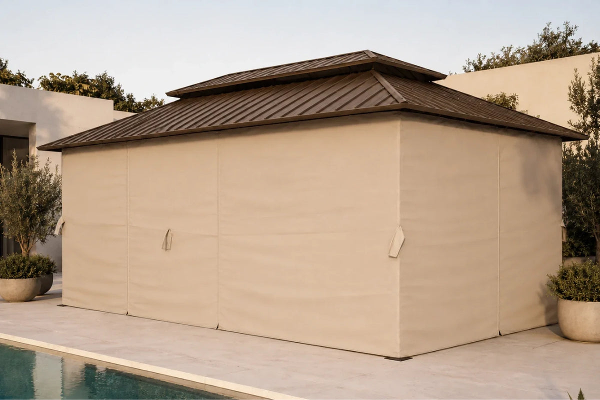 Hardtop gazebo with netting and curtains, situated next to a swimming pool on a light stone patio.