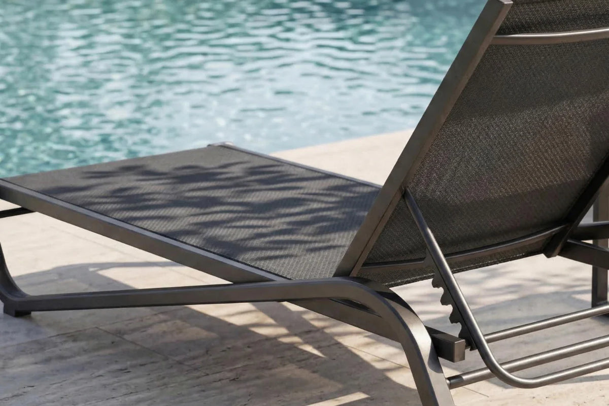 Black lounge chair by a pool