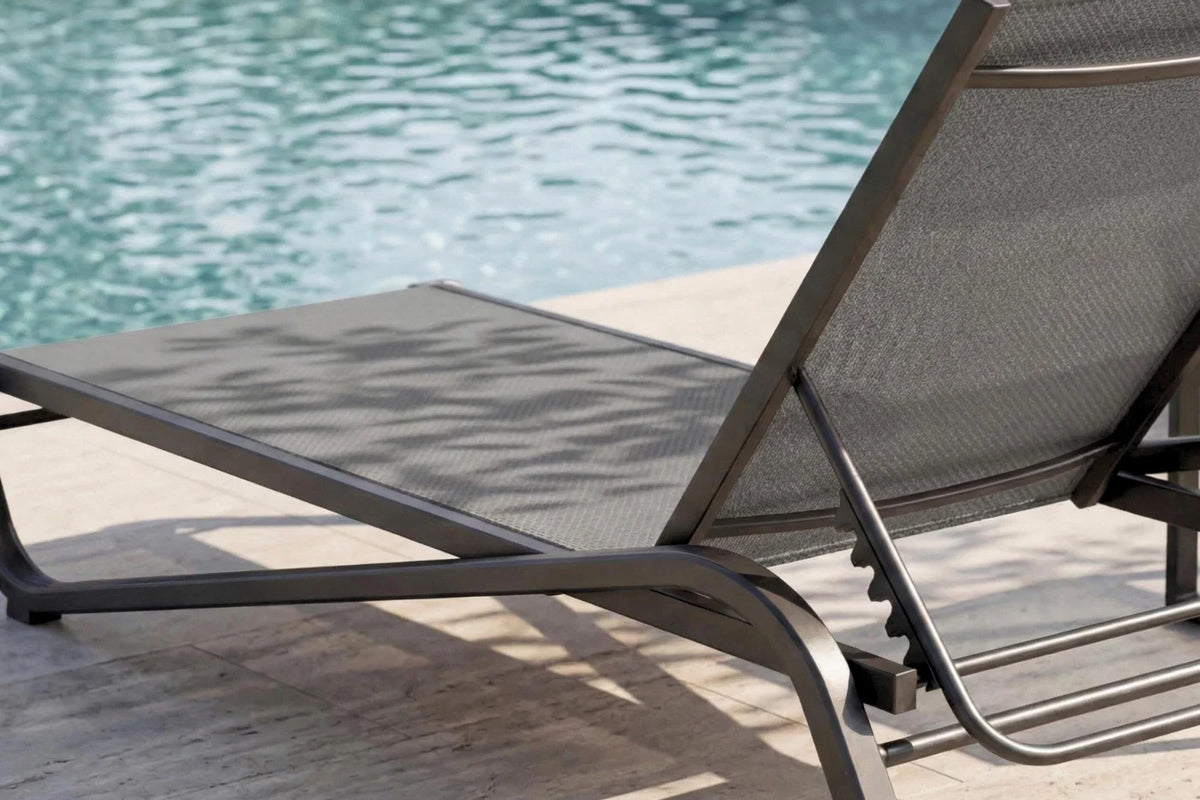 Gray lounge chair by a pool