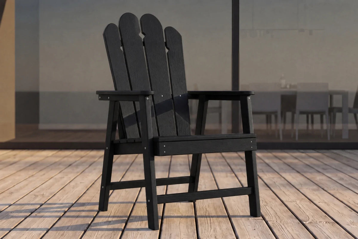 Black HDPE chair on a wooden deck with a blurred background