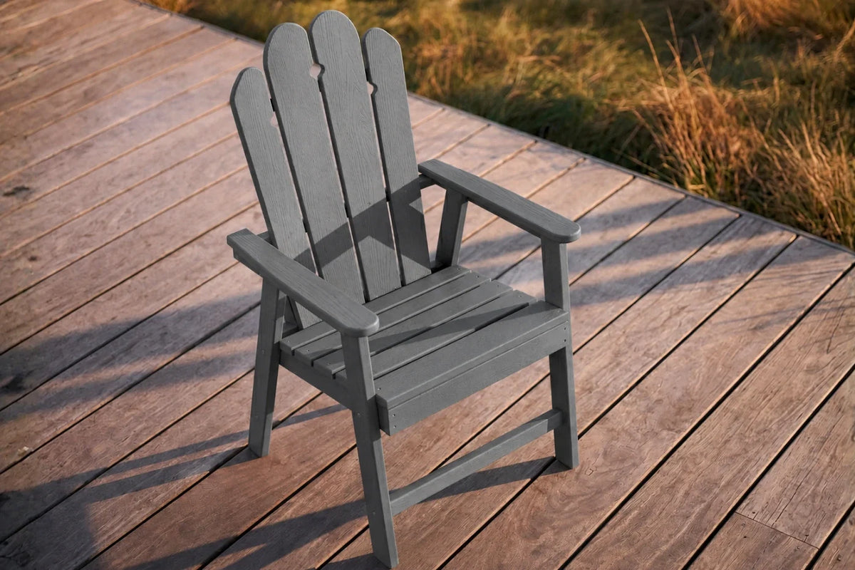 Dark Gray HDPE chair on a wooden deck with grass in the background