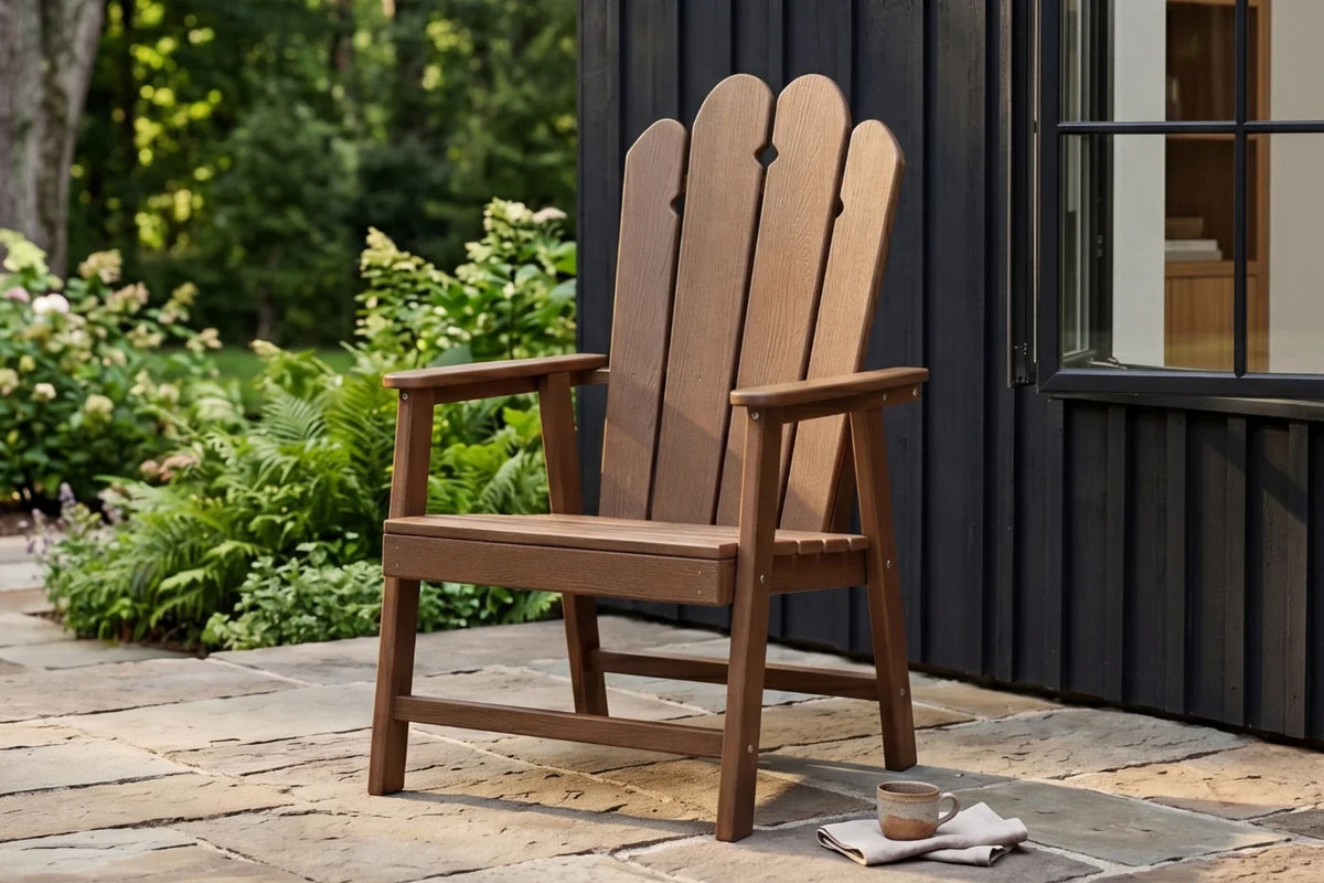 Light brown HDPE chair on a stone patio with garden and building in the background