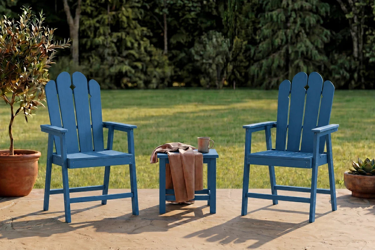 Two navy blue HDPE chairs with a small table on a patio, surrounded by greenery.