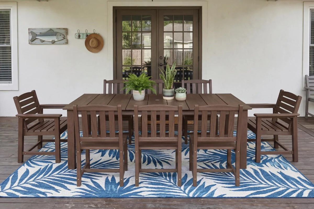 HDPE outdoor dining set with chairs and table on a deck with a blue and white patterned rug.