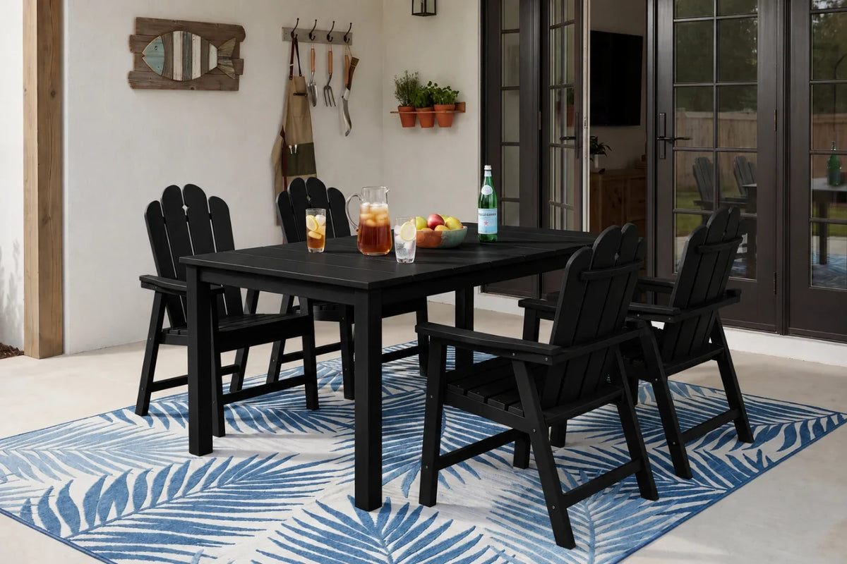 Black outdoor dining set with table and 4 chairs on a blue and white patterned rug.