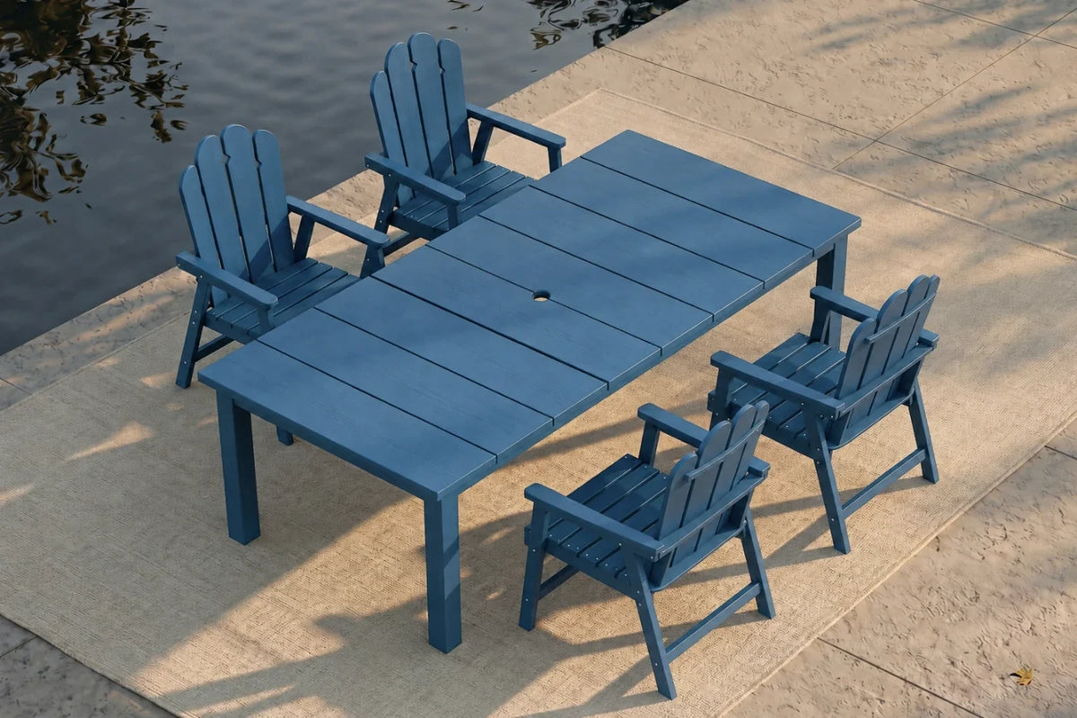 Navy blue outdoor furniture set with table and 4 chairs by a body of water.