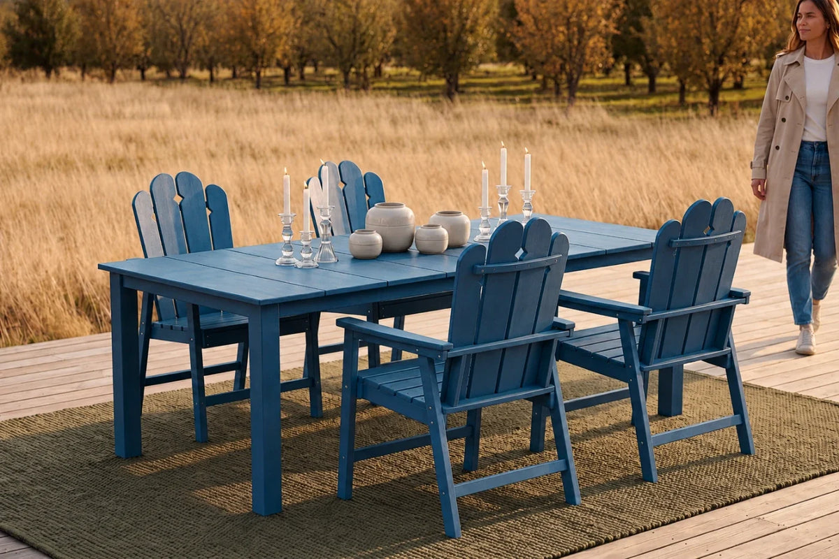 Navy blue outdoor dining set with 4 chairs on a wooden deck, woman walking in the background.
