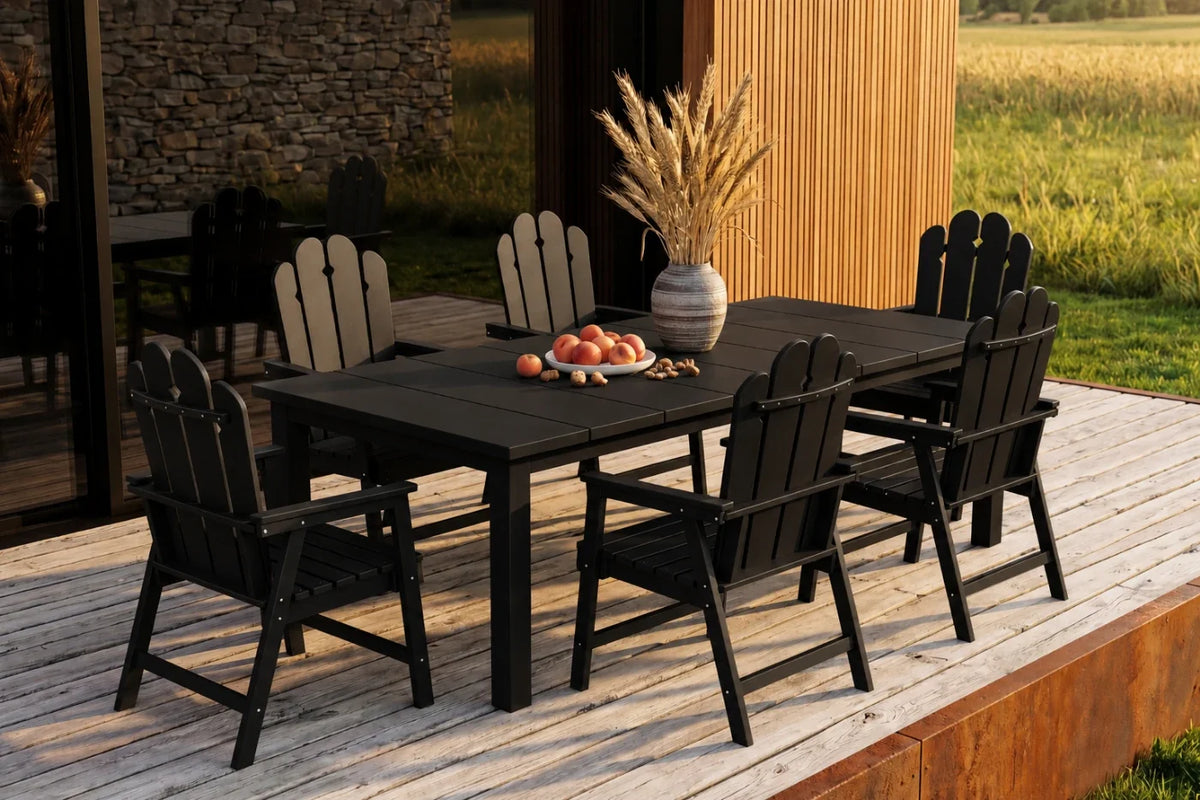 Outdoor dining set with black chairs and table on a wooden deck.