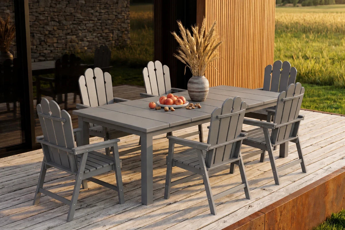 Outdoor dining set with gray chairs and table on a wooden deck.