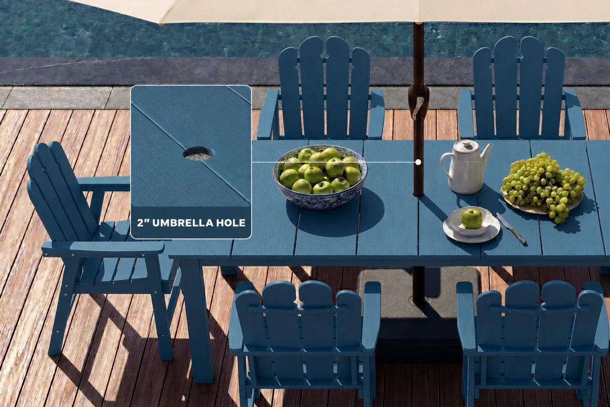 Navy blue outdoor table with chairs on a wooden deck by a pool