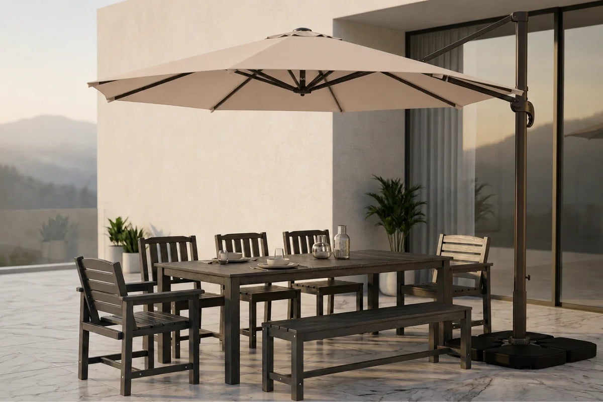 Outdoor patio dining set with a rectangular dark wood table, matching slat chairs, a bench, and a large beige cantilever umbrella on a tiled terrace beside a modern building.