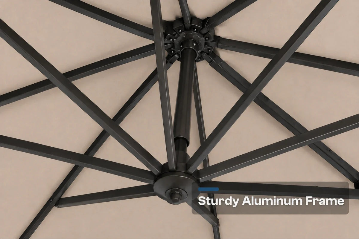 Close-up of a patio umbrella frame showing the black aluminum canopy ribs radiating from the central hub, with a beige fabric canopy visible. Text overlay reads 'Sturdy Aluminum Frame'.