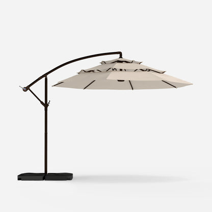 Beige patio umbrella with black frame on a white background