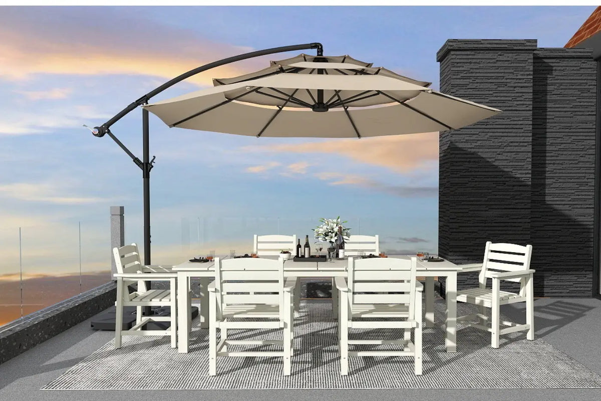 Outdoor dining set with a large umbrella on a rooftop with a cityscape view.