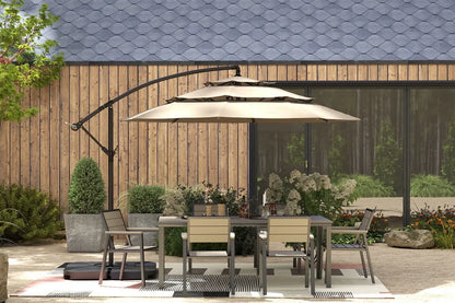 Outdoor patio set with table, chairs, and umbrella in front of a wooden wall.