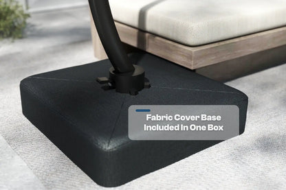 Black fabric-covered outdoor umbrella base on a patio setting