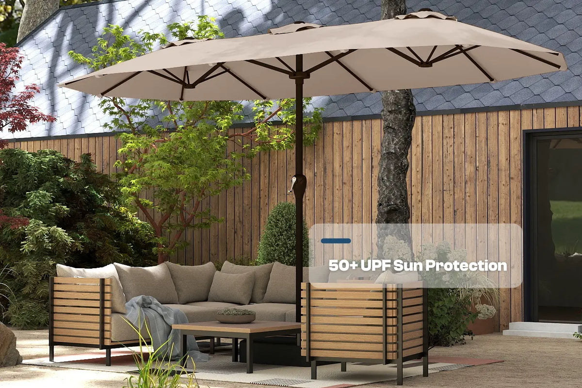 Outdoor patio set with a large umbrella providing shade in a garden setting.