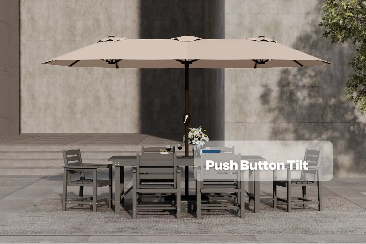 Outdoor dining set with a large beige umbrella on a concrete patio.