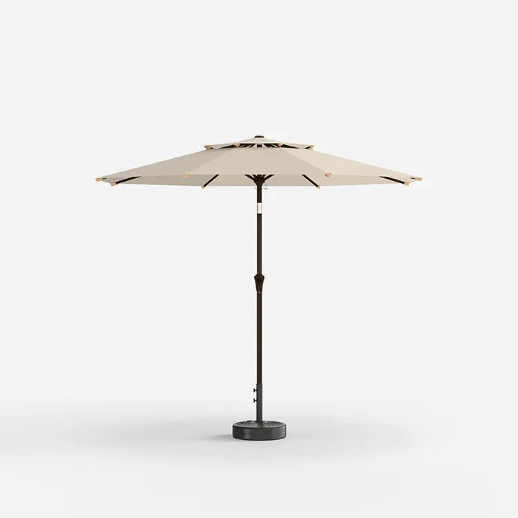 Beige patio umbrella with black base on a white background