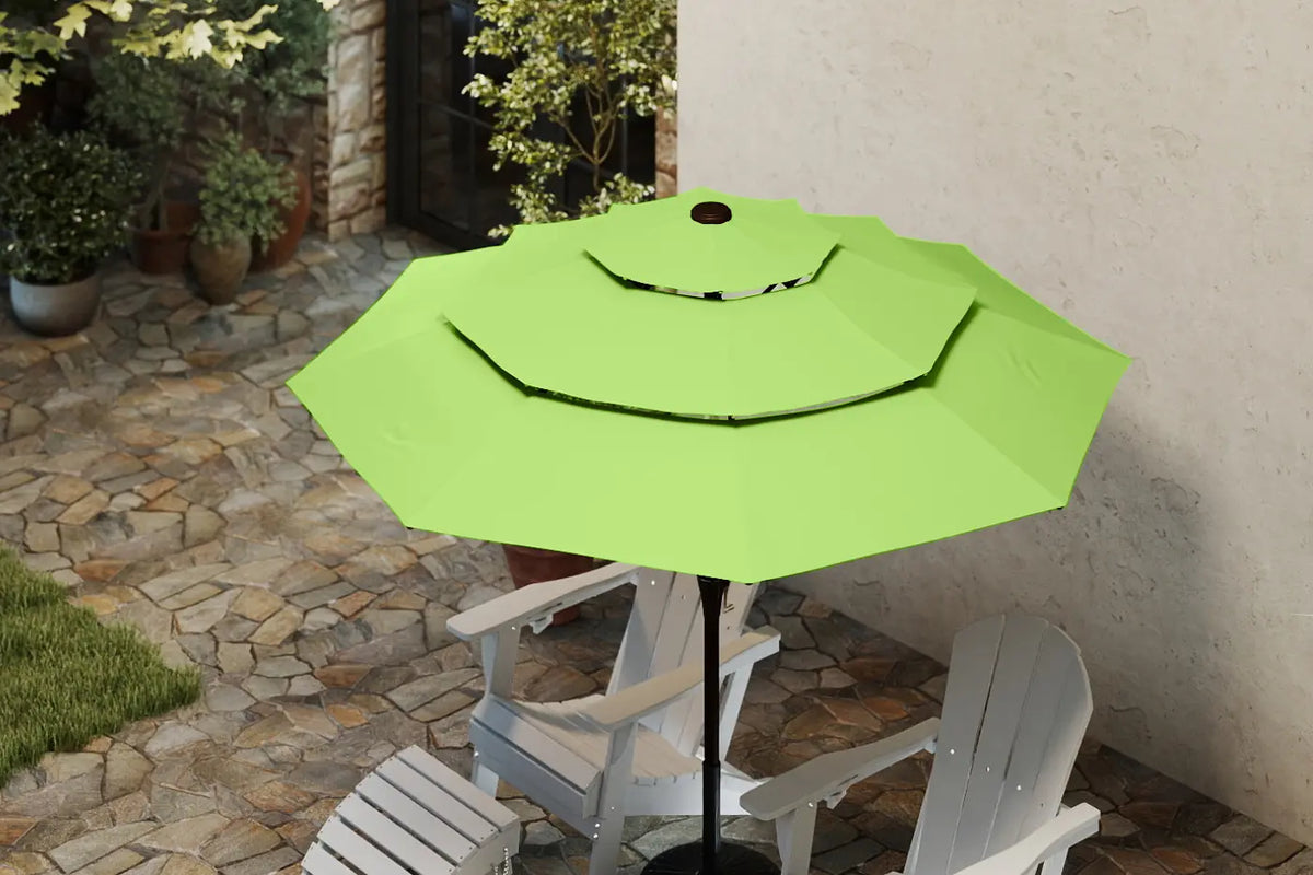 Green patio umbrella on a stand with white chairs in a garden setting