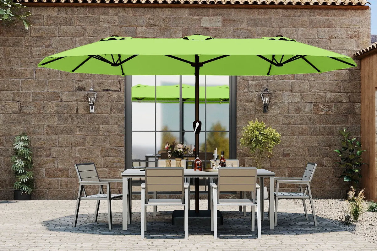 Green patio umbrella over a dining table with chairs in an outdoor setting.