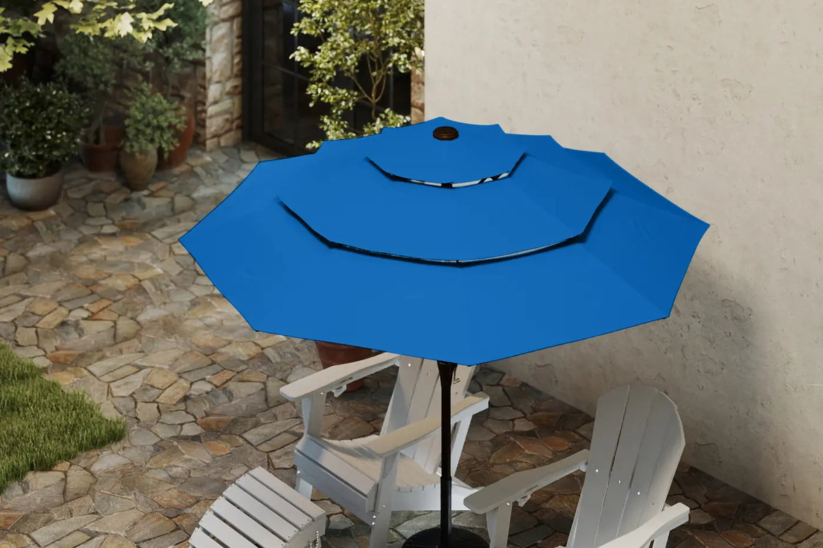 Blue patio umbrella on a stand with white chairs in a garden setting