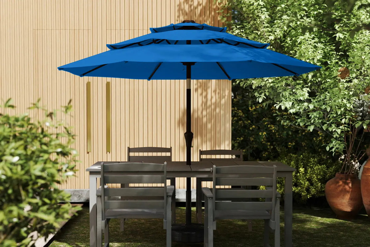 Garden table with chairs and a blue umbrella in a garden setting