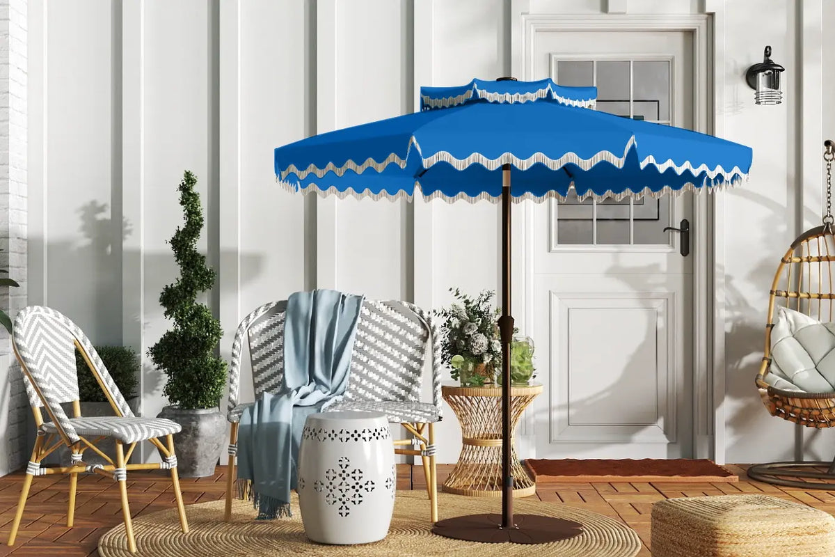 Blue patio umbrella with white trim on a wooden deck