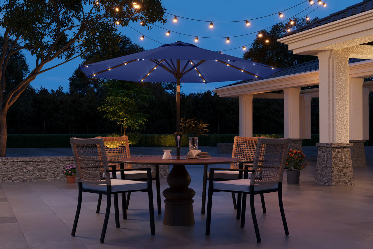 Outdoor patio setting with table, chairs, and string lights at dusk.