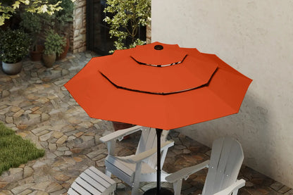 Orange patio umbrella on a stand with white chairs in a garden setting