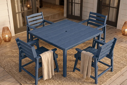 Blue outdoor dining set with four chairs on a patio.