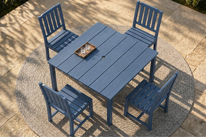Blue outdoor table with four matching chairs on a stone patio.